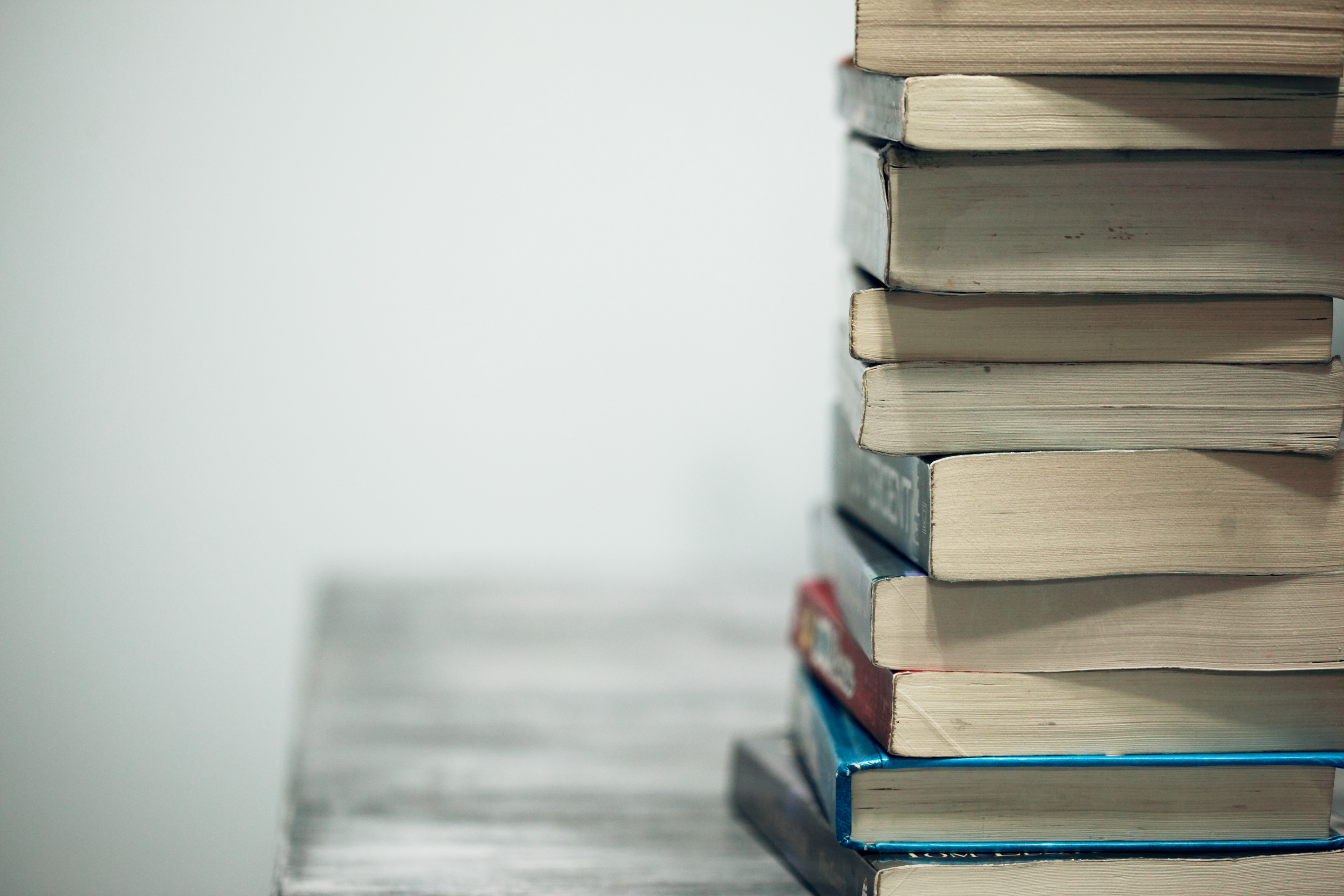 A stack of paperback books.